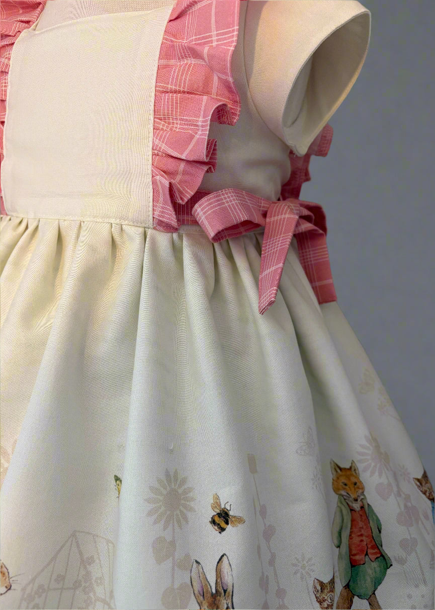 Peter rabbit frill dress side view of ties