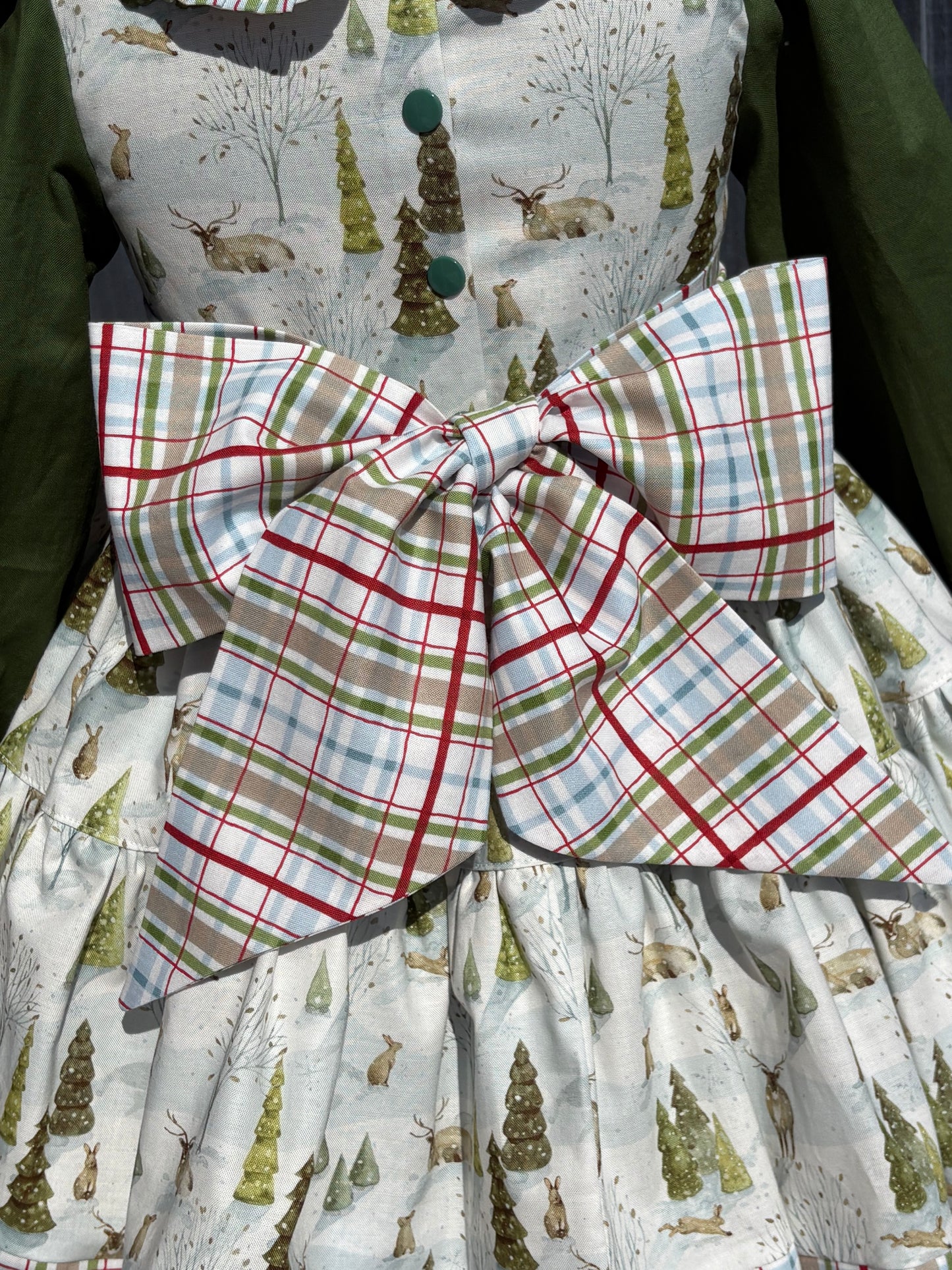 Plaid fabric with green, red, and white pattern