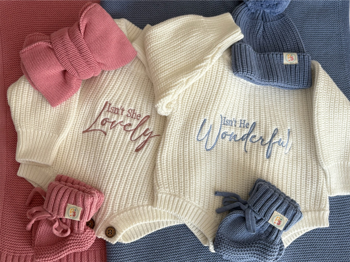 Newborn Knit Romper Gift Sets for Girls and Boys – Cream rompers with “Isn’t She Lovely” and “Isn’t He Wonderful” embroidery, paired with matching knit blankets, booties, and accessories.