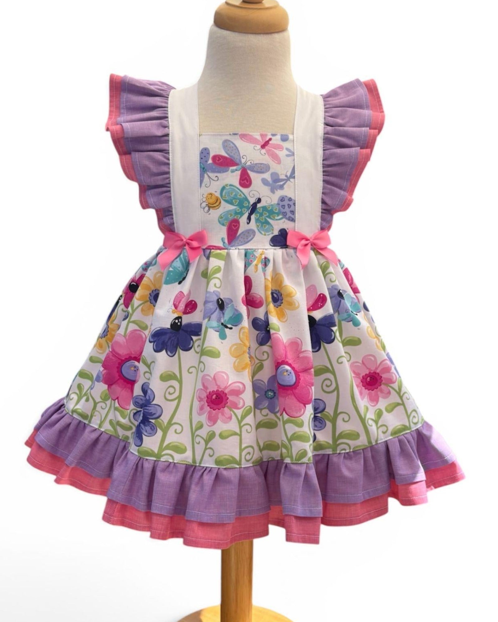 girls summer dress with butterfly print and pink and lavender ruffles, front view