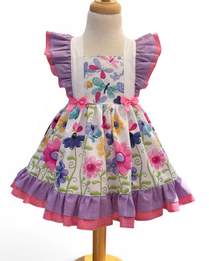 girls summer dress with butterfly print and pink and lavender ruffles, front view