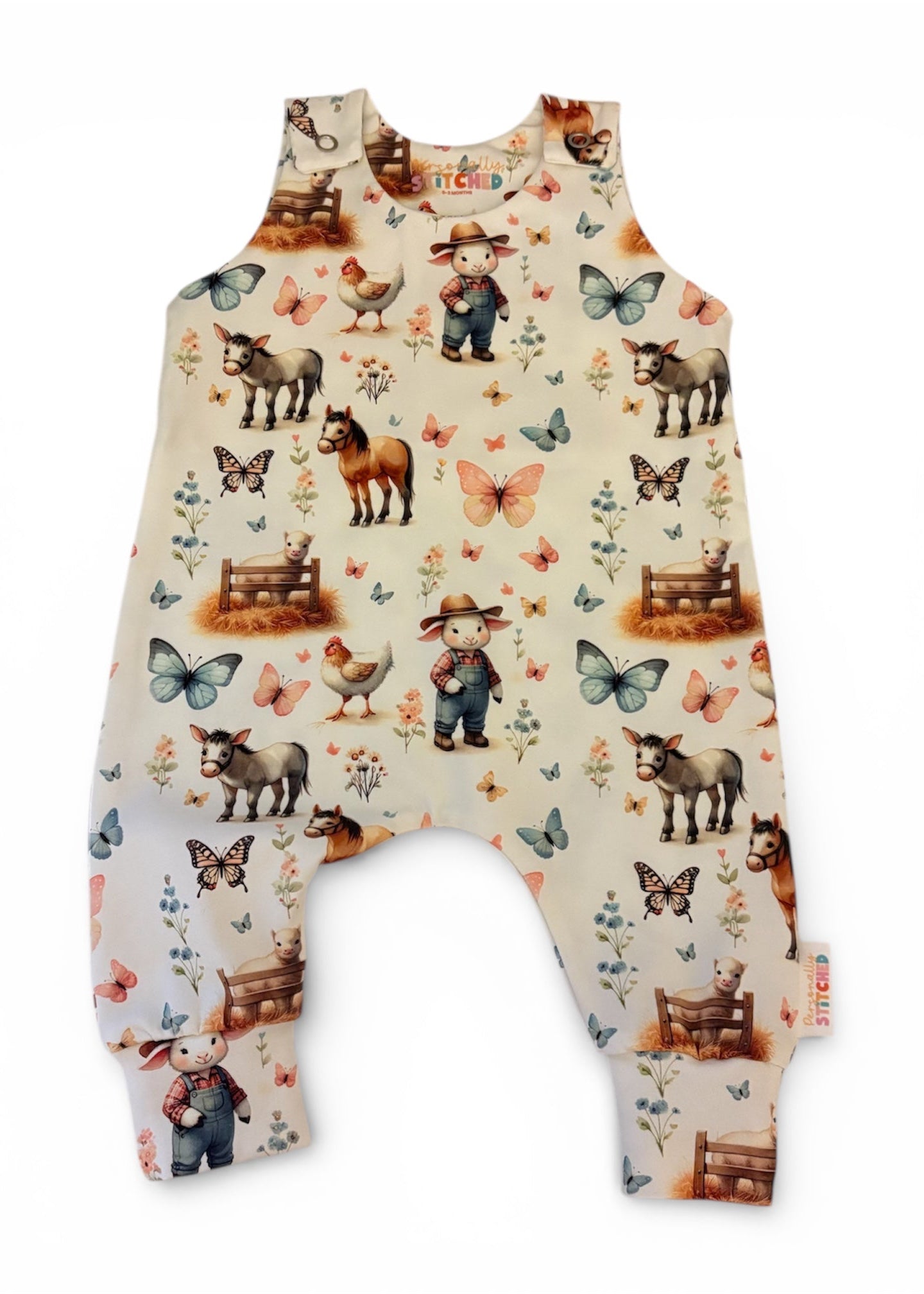 Baby romper with farm animal and butterfly pattern on a white background