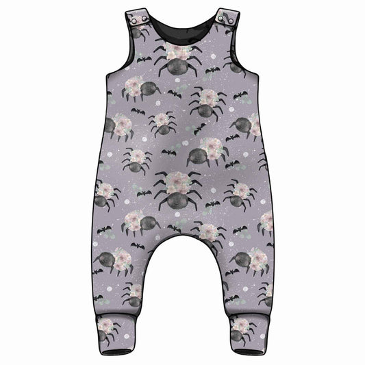 Handmade floral spider print baby romper with purple background 