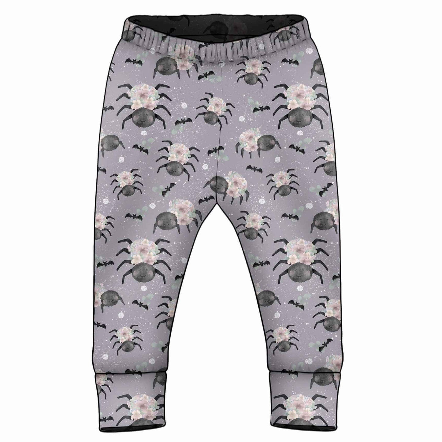 A pair of toddler's elastic-waist pants in a light purple color, featuring an all-over Halloween print of floral spiders and small black bats with cuffed ankles