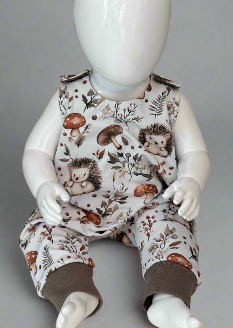 Hedgehog print baby romper with contrast cuffs close up