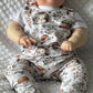 Baby dressed in Hedgehog print romper with plain white tshirt under