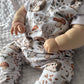 close up of baby dressed in hedgehog romper