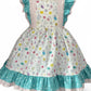 Children's dress with floral pattern and turquoise trim on a mannequin against a white background