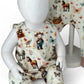 Child's outfit with animal print on a mannequin against a floral background
