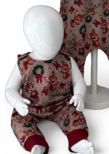 Close up view of Children's romper with reindeer pattern