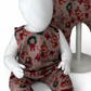 Close up view of Children's romper with reindeer pattern