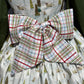 Plaid fabric with green, red, and white pattern