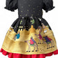 Traditional handmade Christmas dress with nativity print fabric, gold star bow, and red underskirt, available in toddler and girls’ sizes