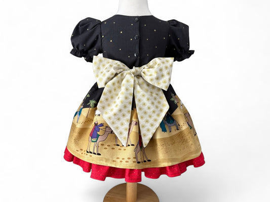 Handmade children’s Christmas dress in Lewis & Irene Away in a Manger nativity print with gold star bow, sizes 12 months to 6 years