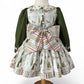 Back view of handmade Christmas dress for girls with oversized bow and button closure