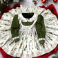 Holiday outfit for girls featuring green and white plaid tree farm fabric and statement bow