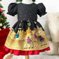 Children's dress with festive design on a mannequin against a Christmas-themed background