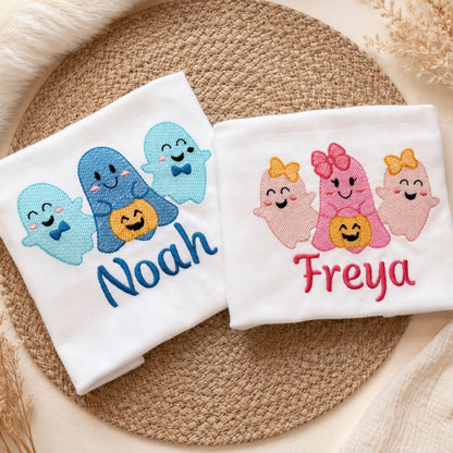 Two white kids' Halloween t-shirts with embroidered ghost trio designs — blue Boo Crew and pink Boo Crew — personalised with names, by Personally Stitched