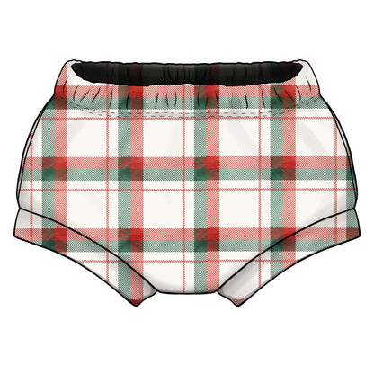 A pair of baby boy shorts with a red, green, and white plaid pattern, featuring an elasticated waist and cuffed leg bands.