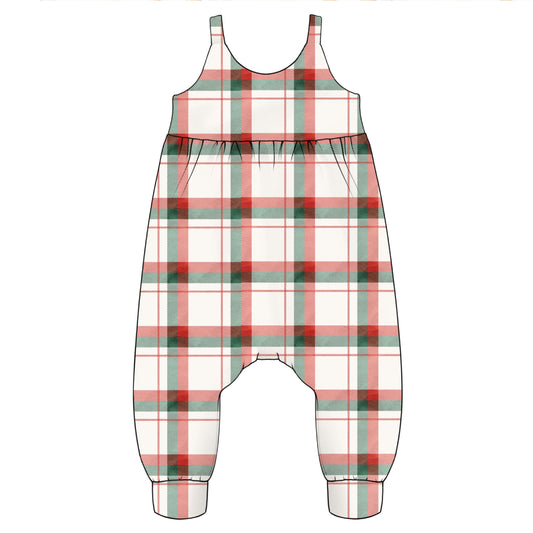 A sleeveless one-piece romper or for babies and young children with a plaid pattern in festive Christmas colours.