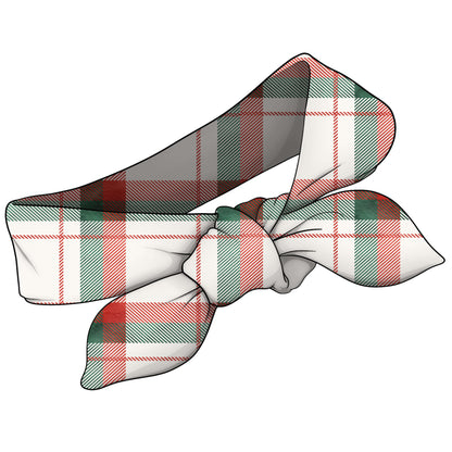 A fabric hair bow with a tartan plaid pattern in white, red, and green, shown on a solid white background.