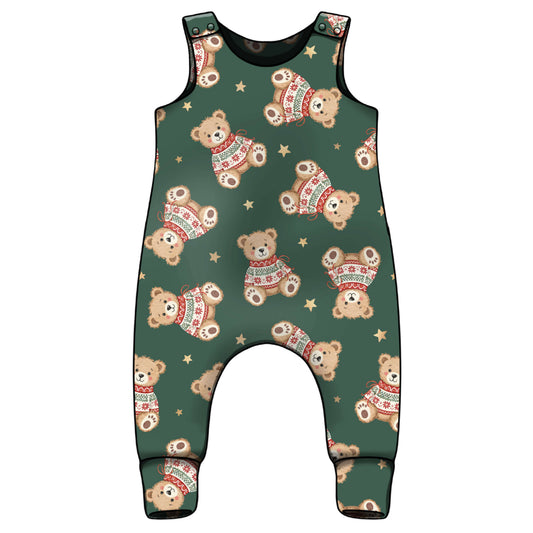 A dark green baby romper with an all-over print of teddy bears wearing red and white sweaters and small gold stars, shown against a plain white background.