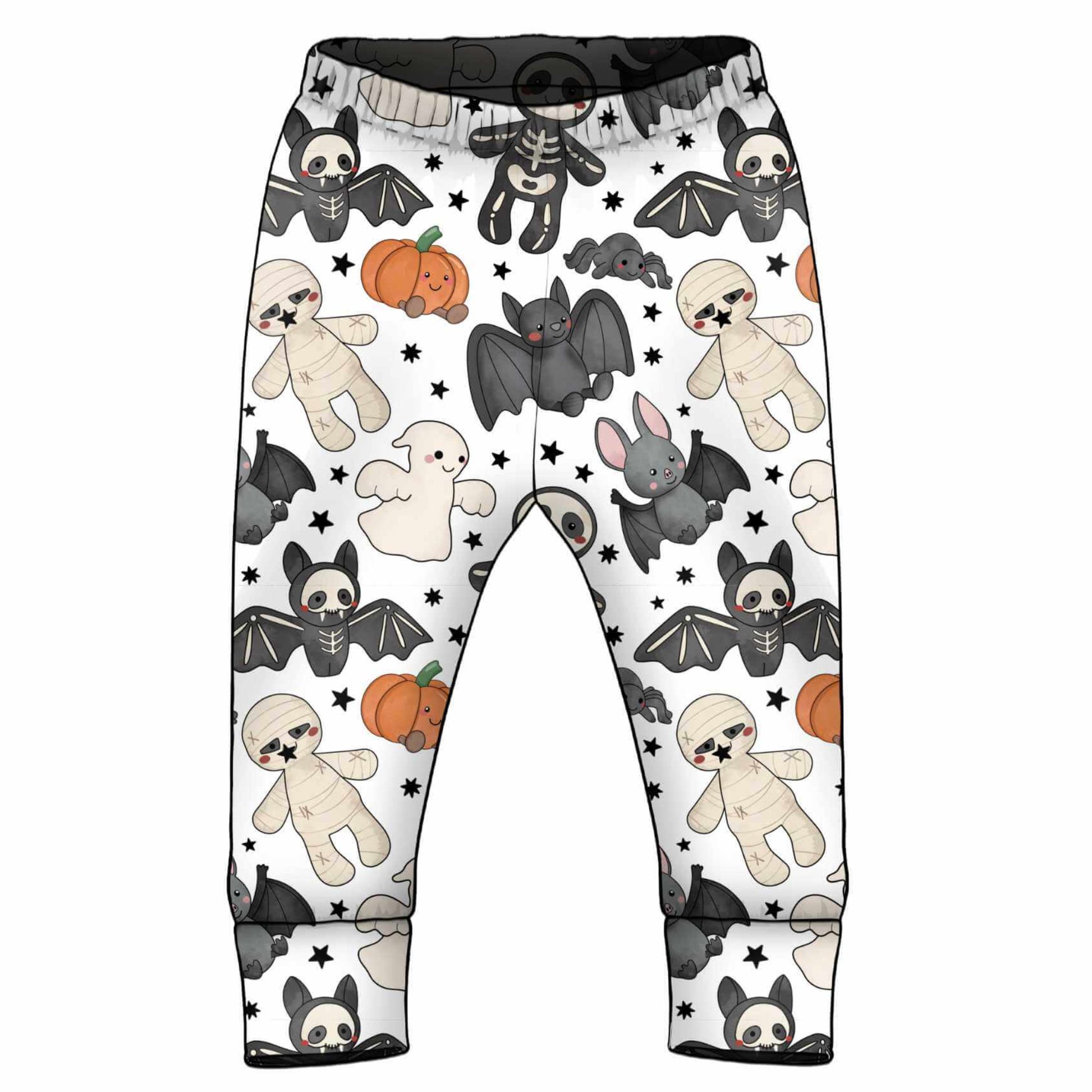White children's pants with a Halloween-themed print featuring cartoon bats, skeletons, pumpkins, ghosts, and stuffed animals, shown on a plain white background.