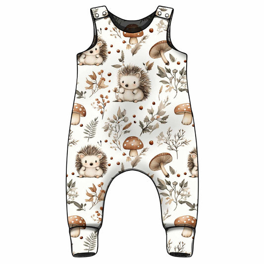 Baby romper with hedgehog and mushroom pattern on a white background