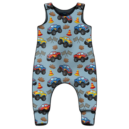 Children's sleeveless romper with monster truck pattern on a light blue background