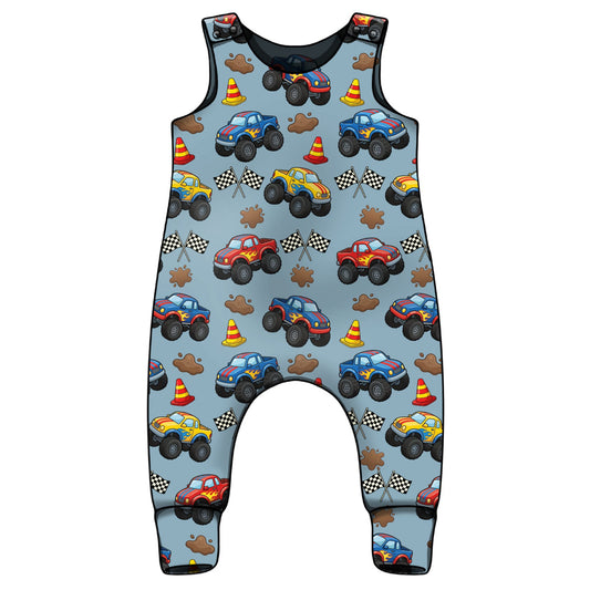 Children's sleeveless romper with monster truck pattern on a light blue background