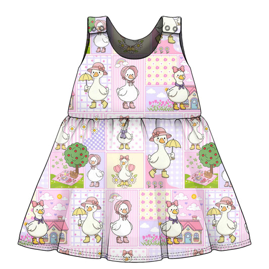 Children's dress with goose and girl pattern on a white background