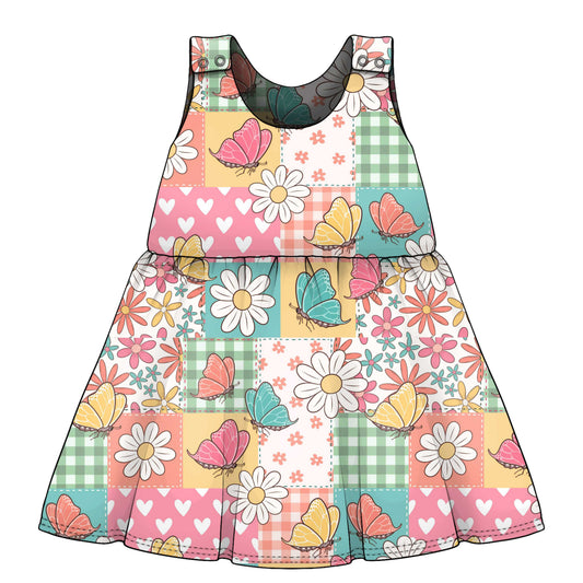 Colorful dress with floral and butterfly pattern on a white background