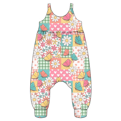 Colourful children's overalls with floral and butterfly pattern in a patchwork design background