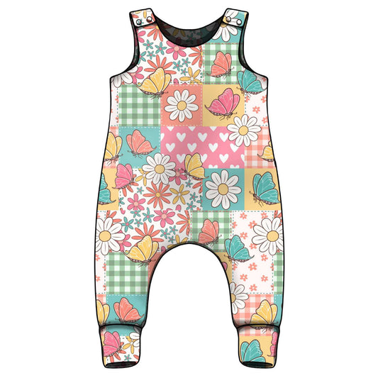 Colorful children's romper with floral and butterfly pattern on a white background