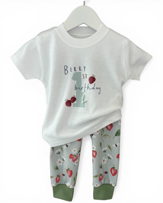 Personally Stitched white t-shirt with "Berry 1st Birthday" print and green strawberry print organic cotton jersey pants.