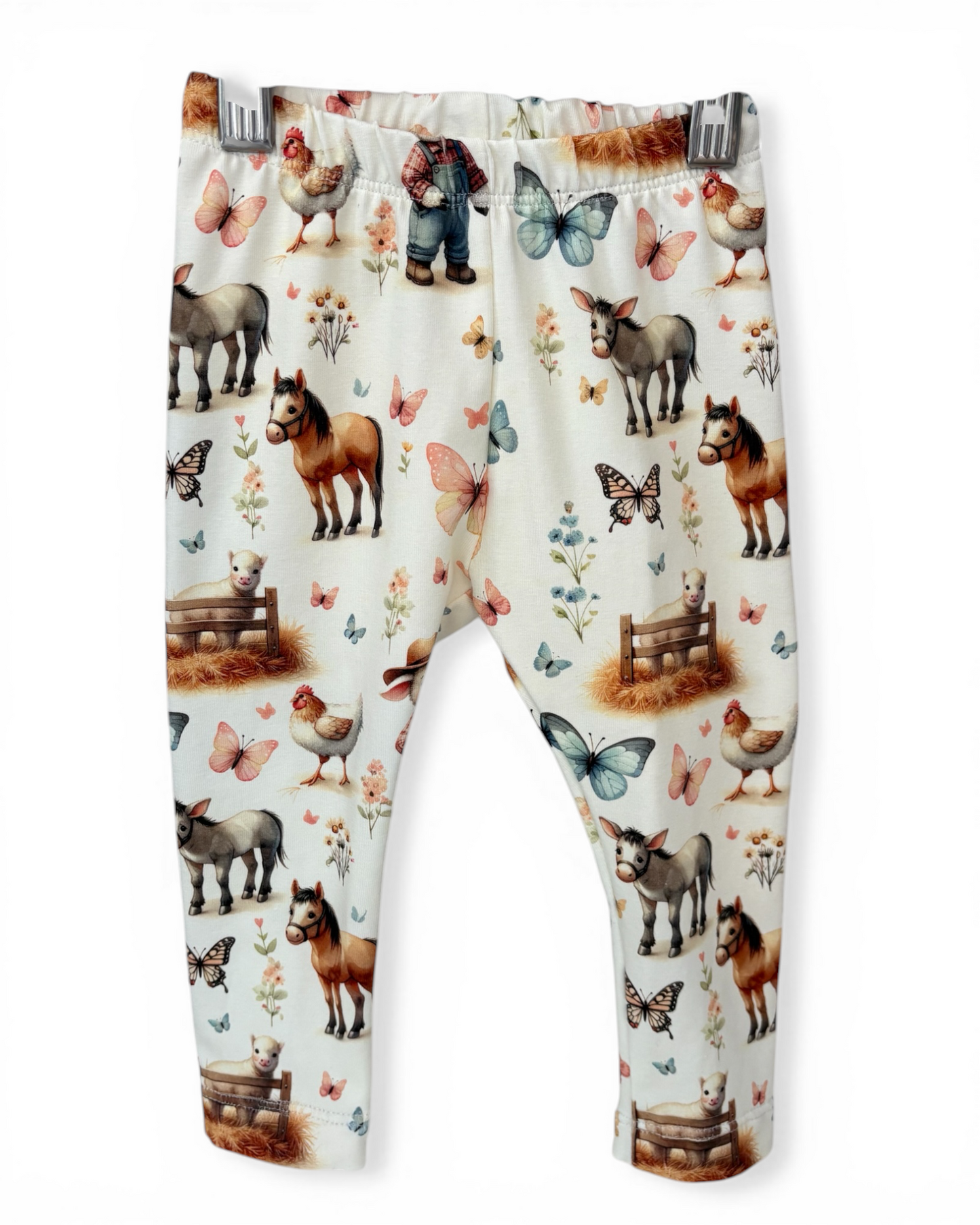 Personally Stitched white cotton leggings with a farm animal and butterfly print, featuring horses, donkeys, chickens, and a lamb.
