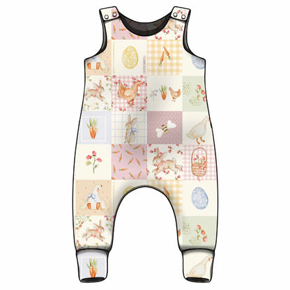 Baby romper with Spring-themed patchwork design with matching print for the ankle cuffs.